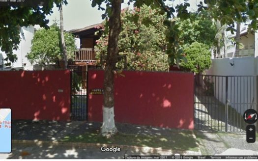 Land with house by the sea